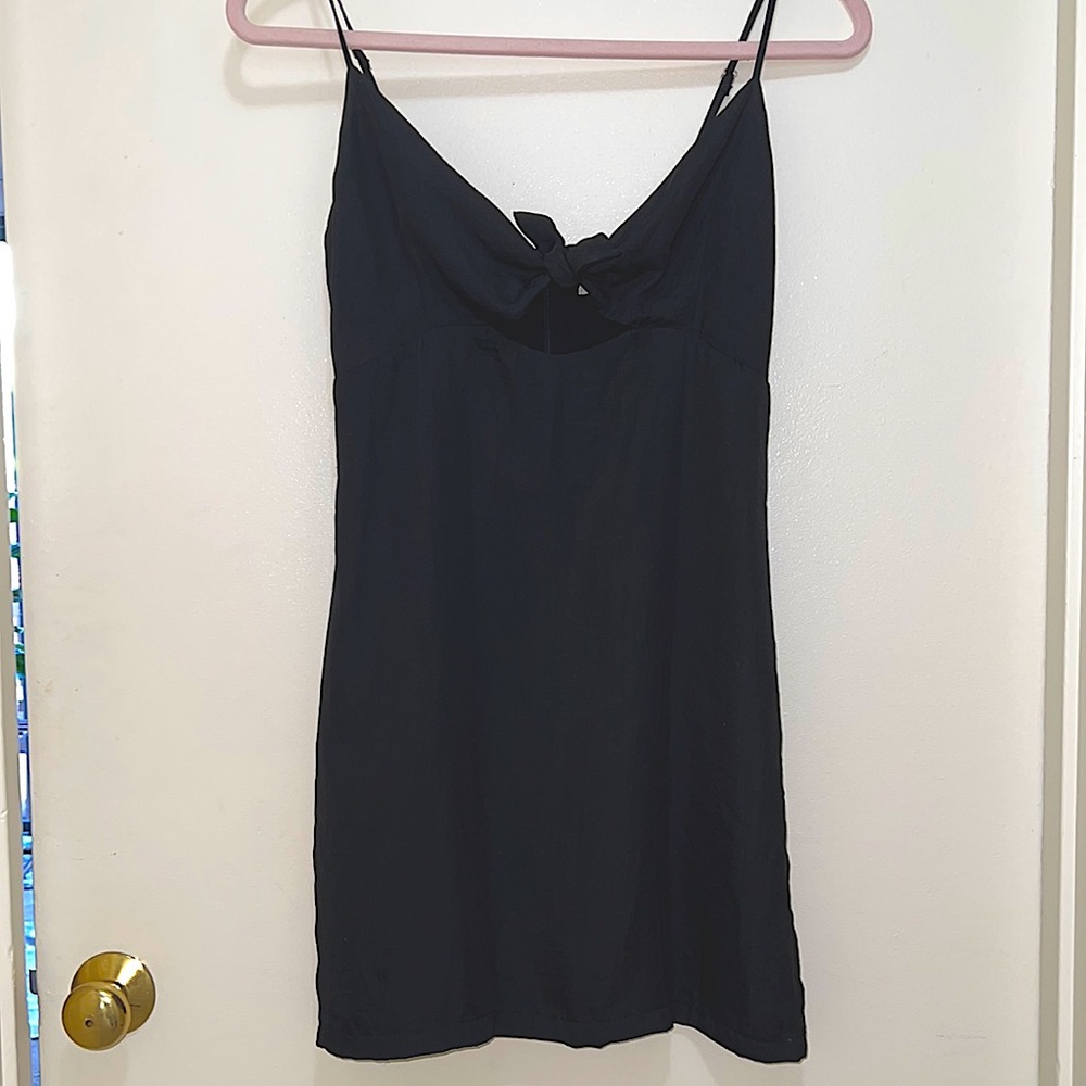 Black spaghetti strap dress with tie bow front.
